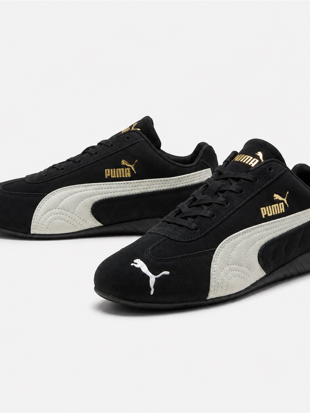 Puma Speedcats Black Sneakers with White Side Stripe and Gold Accents
